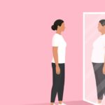 Woman looking at the mirror and seeing herself as overweight