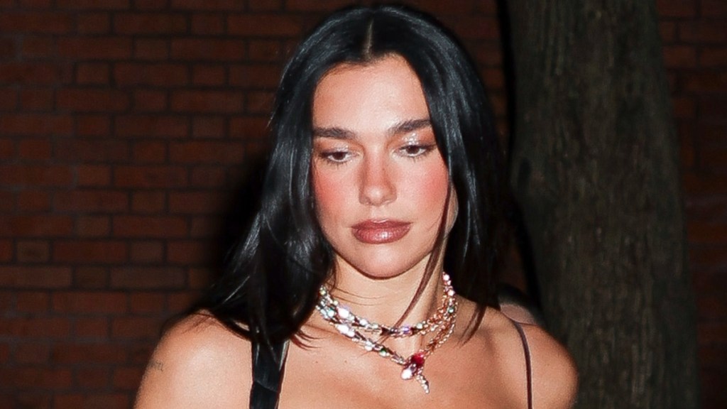 Dua Lipa Stuns in Bold Tassel Gown at NYC Fashion Event