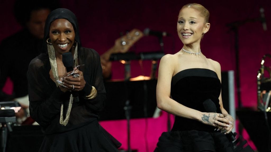 Ariana Grande & Cynthia Erivo Rush to Comfort Fan After Spill