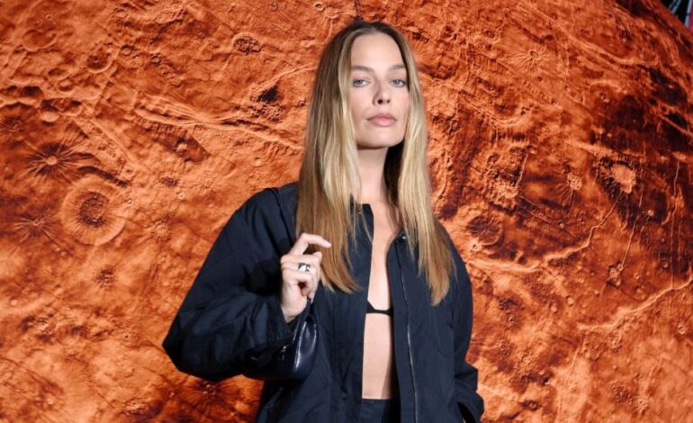 Margot Robbie Dazzles at Chanel Show with Bold All-Black Ensemble