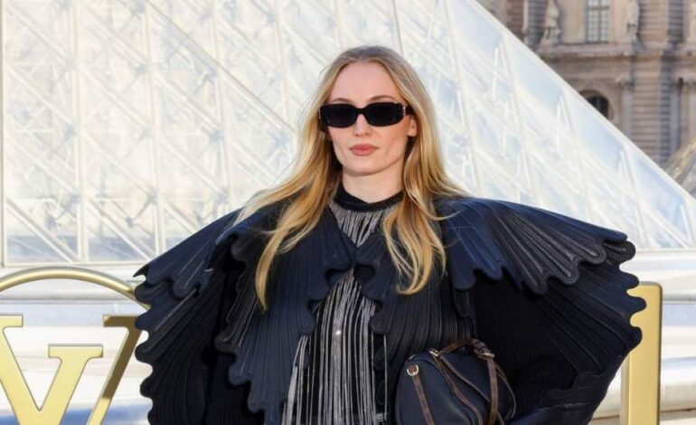 Sophie Turner Stuns in Sculptural Jacket at Louis Vuitton Show