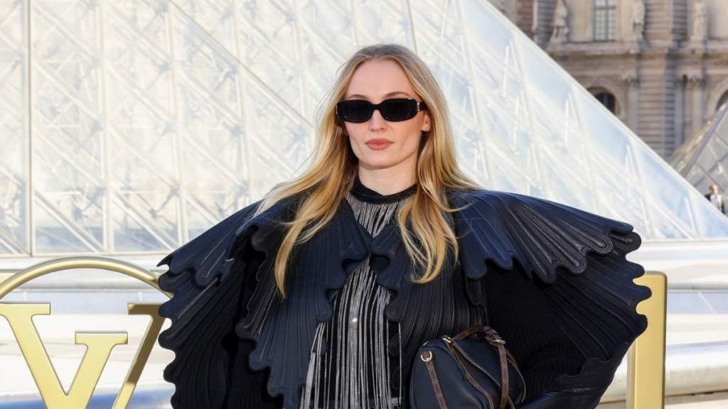 Sophie Turner Stuns in Sculptural Jacket at Louis Vuitton Show