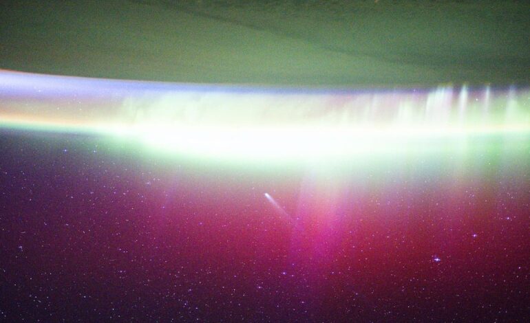 Astronauts Capture Stunning Image of Comet Lemmon Amid Auroras