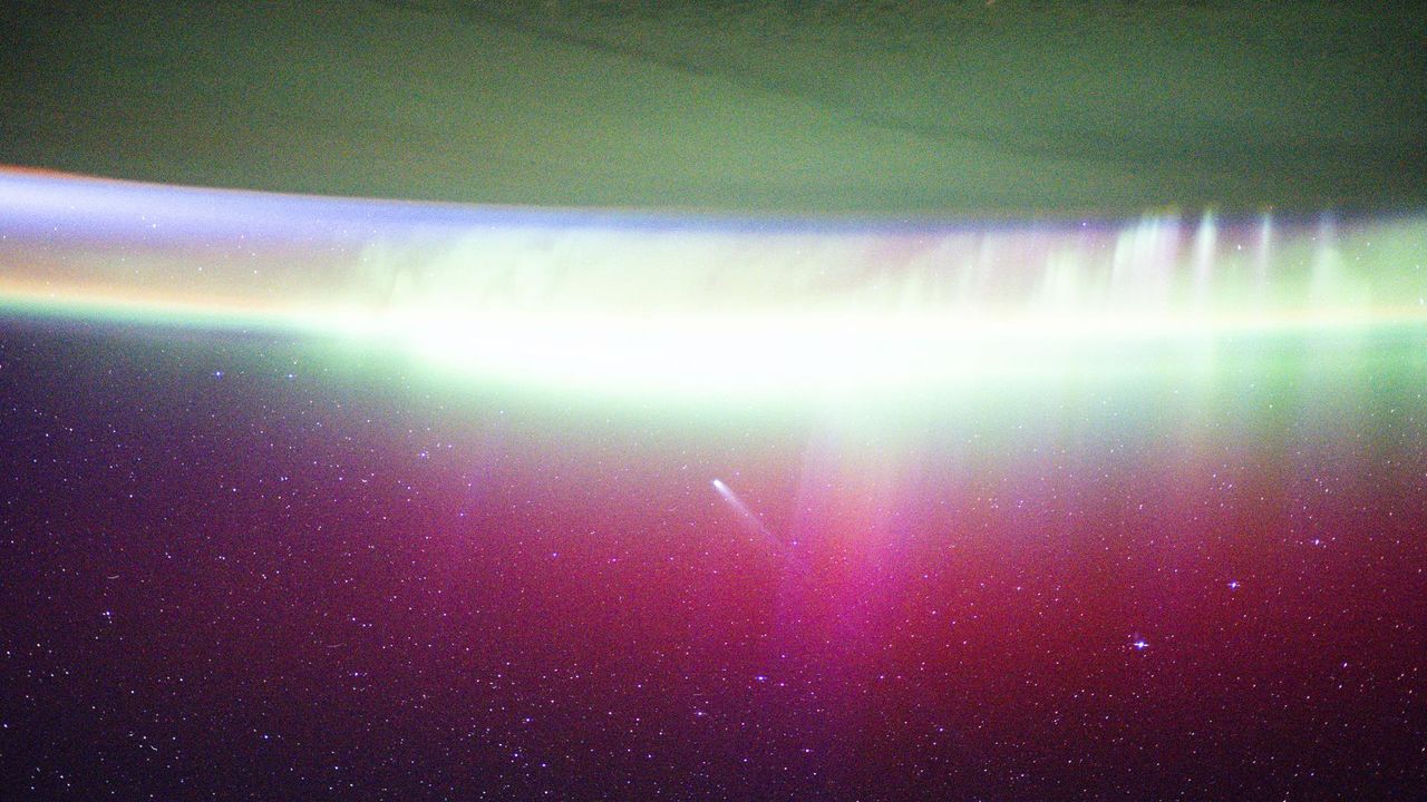 Astronauts Capture Stunning Image of Comet Lemmon Amid Auroras